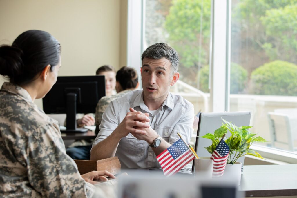 A compliance consultant explains the latest CMMC Phase II changes to their client.