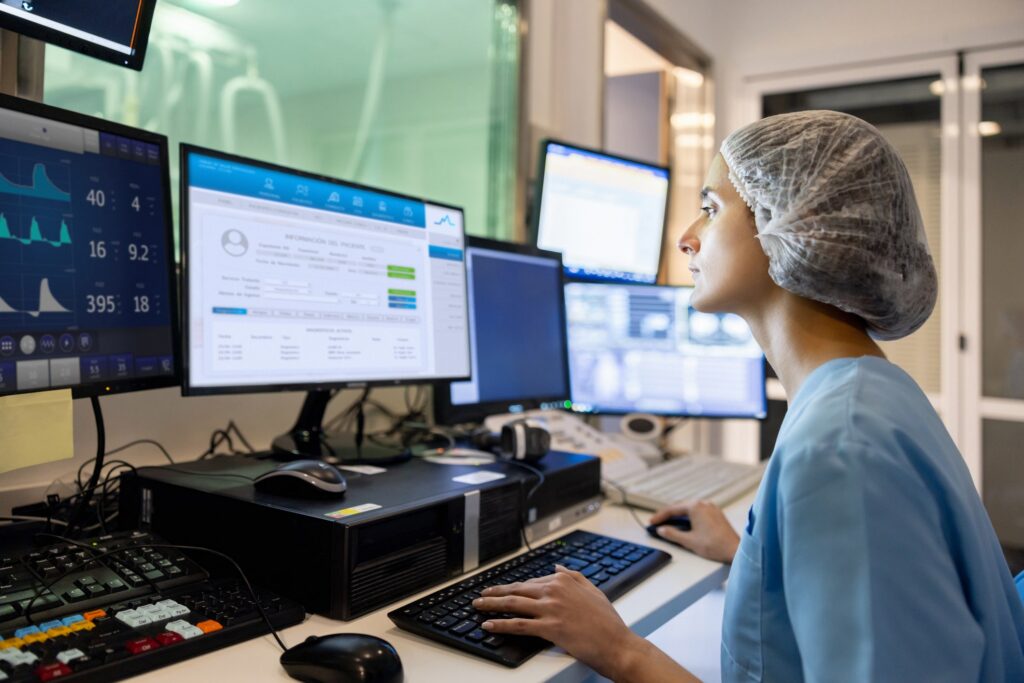 A healthcare professional examines patient data in alignment with PCI standards.