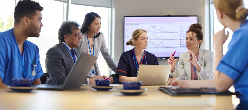 A business professional examines data to ensure it’s aligned with their organization’s data retention policy.