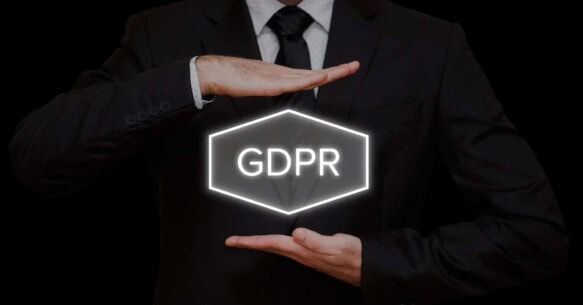 business man holds a sign with GDPR written on it